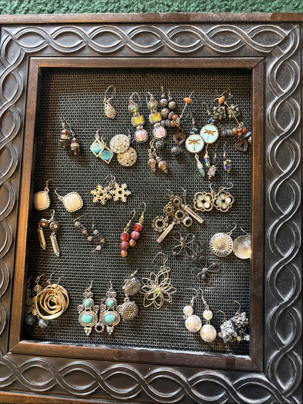 Assorting earrings . Frame is not included . Most earrings need backs
